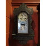 An early 20th Century American Ansonia Cuba 8-day striking wall clock, Roman numerated dial