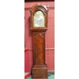 An early 19th Century flame mahogany longcase clock, silvered Roman numerated chapter ring with