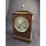 A mahogany and brass inlaid bracket clock, Roman numerated silvered dial, brass presentation