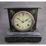 A late 19th Century American Waterbury shelf clock, strikes hours on a gong and half hours on a