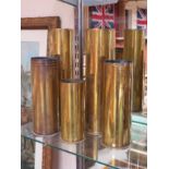 Five brass shell cases including WWI