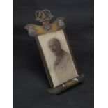 A WWI era trench art brass photograph frame with Argyll and Sutherland Highlanders badge,