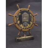 A WWI Austro Hungarian trench art model of a ships wheel with central cap badge and iron cross