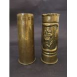 Two brass shell cases, one with trench art design of flower,