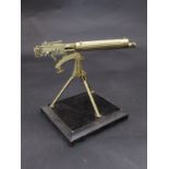 A Vickers machine gun model on plinth base