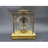 A Kundo electronic mantel clock and a skeletonised clock on onyx base