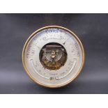 A brass cased marine aneroid barometer/thermometer maker Whyte Thomson & Co.