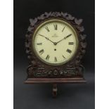 A 19th Century mahogany cased dial clock with integrated bracket,