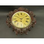 A 19th Century mahogany cased dial clock with carved foliate detail,