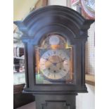 An oak cased triple train grandmother clock, early 20th Century, Roman numerals,