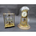 Two anniversary clocks including Kundo