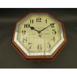 An early 20th Century mahogany cased Art Deco dial clock of octagonal form,