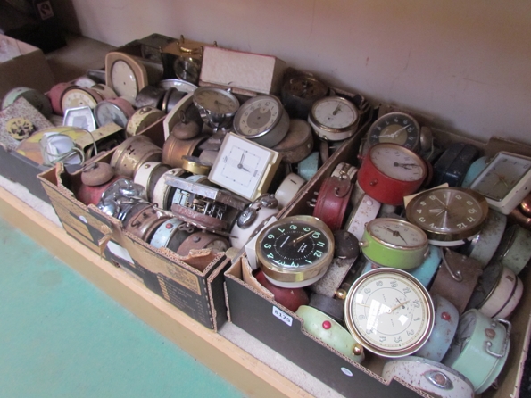 Three boxes of assorted alarm and desk clocks