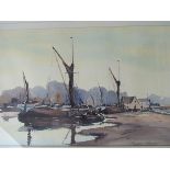 GRAHAM HOWLETT (20th Century): A framed and glazed watercolour "A Suffolk Boatyard".