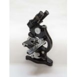 An Ernest Leitz Wetzlar Industrial binocular microscope, lacquered brass and metallic body,