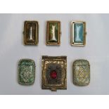 Six 20th Century Eastern brass and base metal vesta boxes,