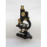 An R & J Beck of London Standard Model I monocular microscope.