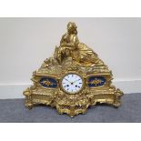 A mid 19th Century French gilt figural mantel clock depicting a recumbent maiden with harp,