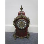 A 19th Century French boulle work mantel clock with ormolu finials, mounts,