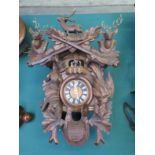 A 20th Century Black Forest cuckoo clock with automaton dancing couples,