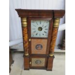 An American wall clock with two glazed doors,