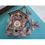 An early to mid 20th Black Forest cuckoo clock with carved decoration