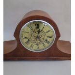 A Napoleon hat shaped Westminster chiming mantel clock with brass Roman dial, key and pendulum.