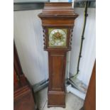 A late 18th/early 19th Century oak longcase clock of diminutive form with barley twist supports,