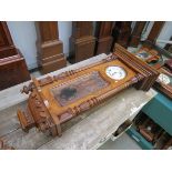 A late 19th Vienna style wall clock in carved and turned walnut case and central Art Nouveau floral