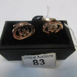 A boxed pair of Gucci cuff links
