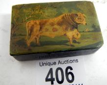 A Pill box with depiction of cow on lid (approx. length 2 1/2" / 6.5 cm)