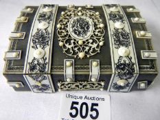 A Paperweight with bone decoration (approx. length 4". width 3", height 1 1/4") - slightly a/f (