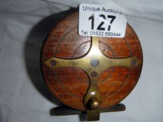 An old wooden fishing reel