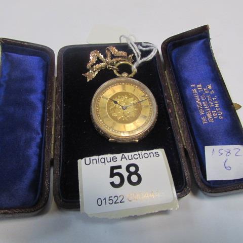 A 14ct gold fob watch with ornate 9ct gold bow in original case
 
Condition
Not currently running