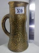 An Elton ware crackle glaze gold vase
 
Condition
Very small flea bite nibble to tip of spout,