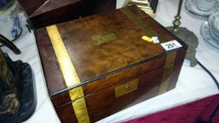 A mahogany brass bound writing box with inkwells