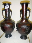 A pair of oriental bronze vases