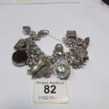 A heavy silver charm bracelet (160gms)