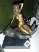 A cold cast bronze of girl in hand