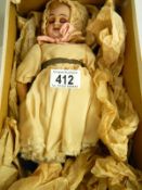 A 19th century doll figure with porcelain head (approximately 1850)
 
Condition
Eyes won’t
