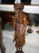 An African carved wooden figure of a man