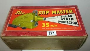 A Stip Master film projector in original