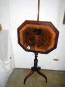 A Victorian fire-screen on adjustable pole and tri-pod base