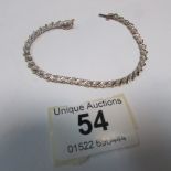 A yellow gold and diamond bracelet
 
Condition
Good condition
18.5cm long including clasp