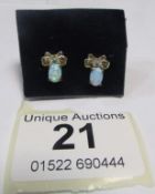 A pair of 9ct gold and opal earrings