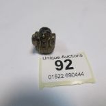 A rare figural promotion dice for Theaks