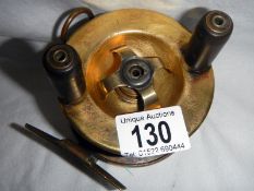 An old brass fishing reel by Ogden