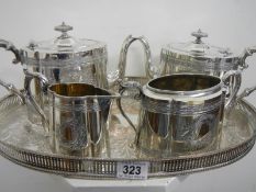 A silver plated gallery tray, 2 teapots,