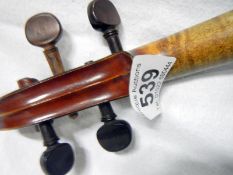 A 1904 violin (approx. length of body 14" / 35.5cm, overall length 23 1/2" / 59.5cm)