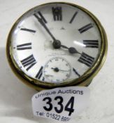 An Edwardian brass car clock in working